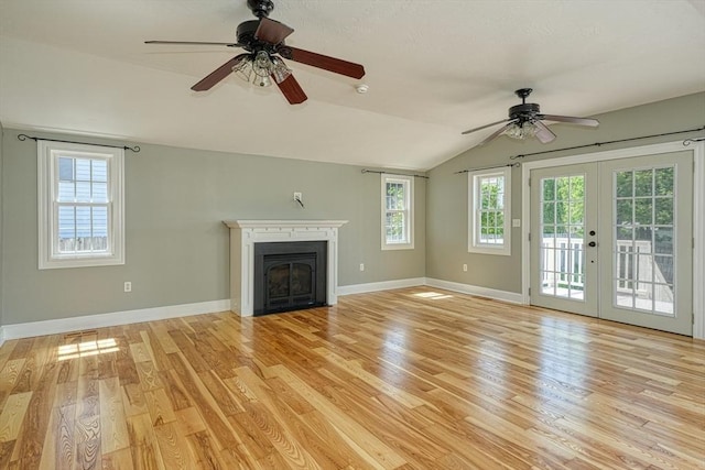 14 Mountain Ave, Marlborough, MA 01752 - unfurnished living room featuring a ceiling fan, light wood-type flooring, lofted ceiling, baseboards, and french doors