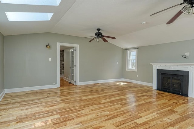 14 Mountain Ave, Marlborough, MA 01752 - unfurnished living room featuring a ceiling fan, vaulted ceiling, a fireplace, and light wood finished floors