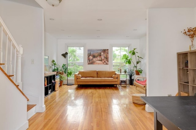 46 Bigelow St Unit 3, Cambridge, MA 02139 - living area with stairway, healthy amount of natural light, and light wood finished floors