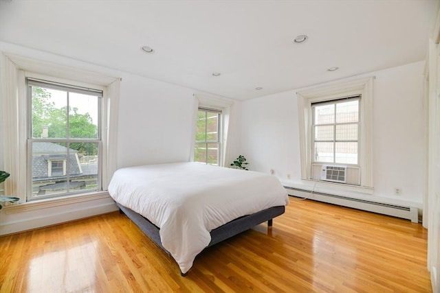 46 Bigelow St Unit 3, Cambridge, MA 02139 - bedroom featuring baseboard heating and light wood finished floors