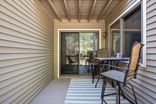 deck with outdoor dining area