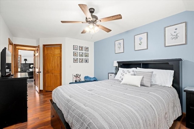 bedroom featuring wood finished floors, a ceiling fan, and vaulted ceiling