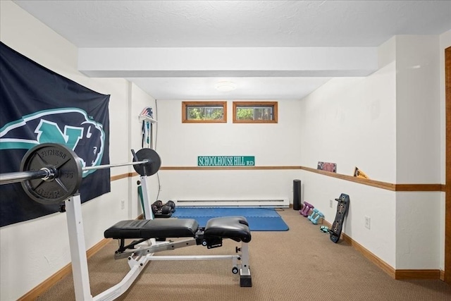 workout area featuring baseboard heating, baseboards, and carpet floors