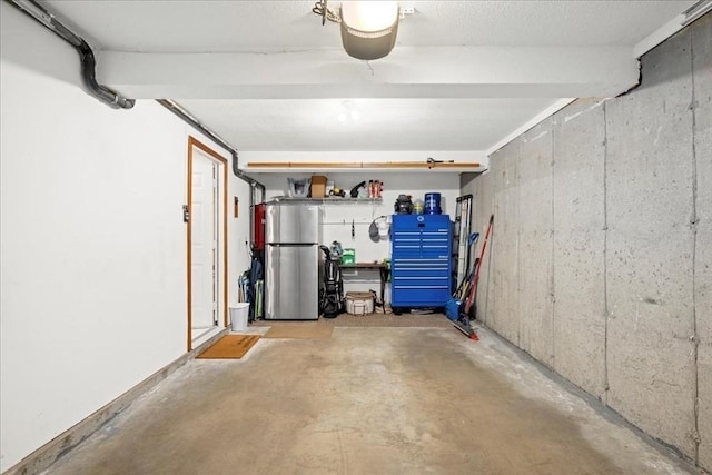 garage with freestanding refrigerator