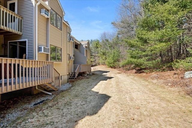 view of side of property with cooling unit