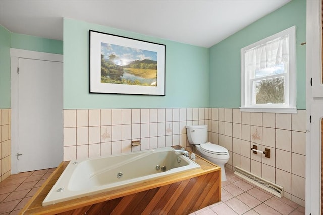 full bathroom with tile walls, a jetted tub, toilet, tile patterned flooring, and visible vents