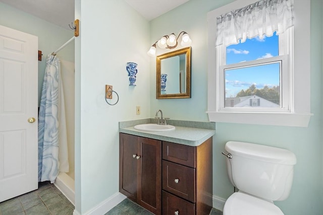 full bath with baseboards, vanity, a shower with shower curtain, and toilet