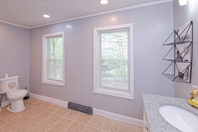 bathroom featuring crown molding, baseboards, toilet, recessed lighting, and tile patterned flooring