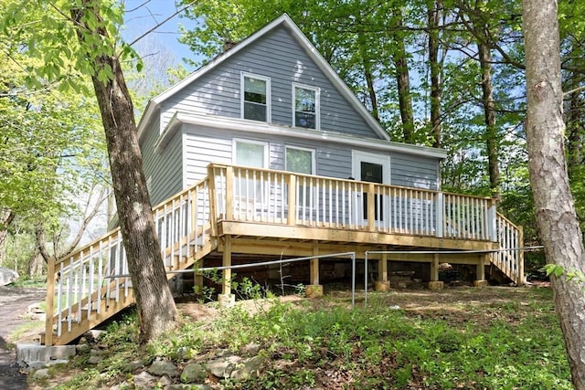back of house with stairs and a deck