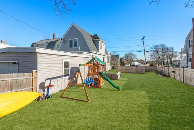 view of play area with a yard and a fenced backyard