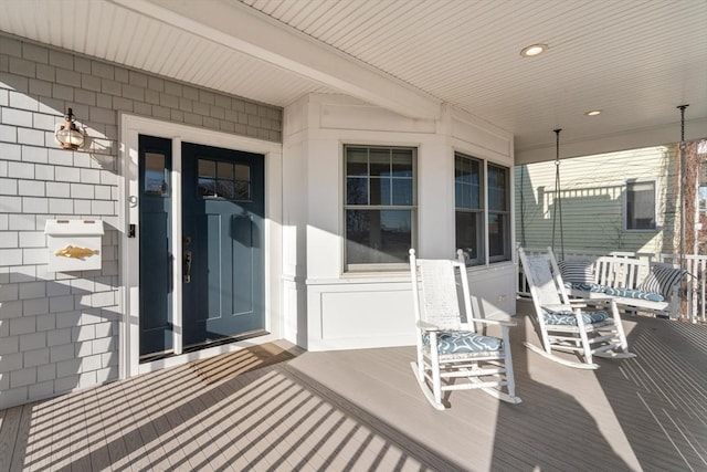 wooden deck featuring covered porch