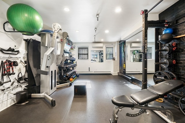 gym with an AC wall unit and a baseboard radiator