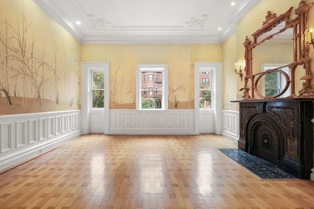 interior space featuring ornamental molding and light hardwood / wood-style flooring