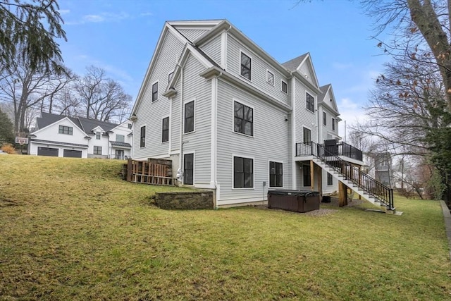 39 Donna Rd, Needham, MA 02494 - back of house featuring a hot tub, stairway, a wooden deck, and a yard
