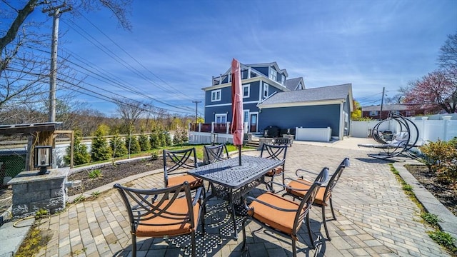 view of patio with outdoor dining area and a fenced backyard