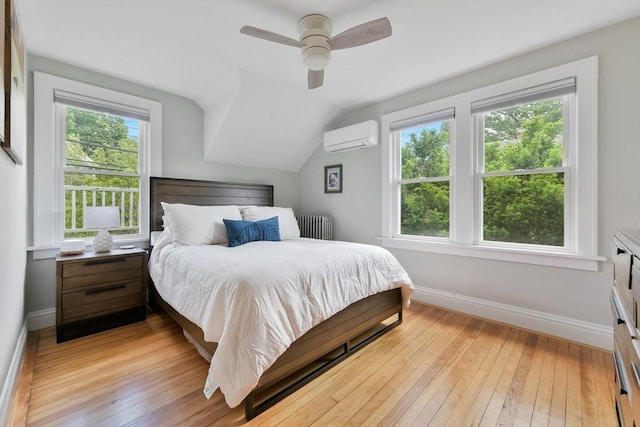 475 E St, Dedham, MA 02026 - bedroom featuring a wall mounted air conditioner, radiator heating unit, baseboards, multiple windows, and vaulted ceiling