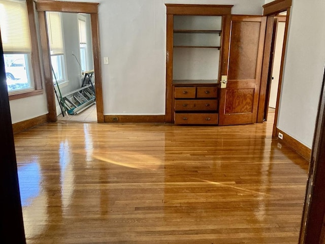 unfurnished bedroom featuring light wood-type flooring