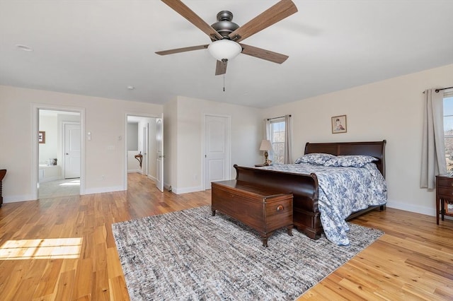 bedroom featuring ceiling fan, baseboards, and wood finished floors