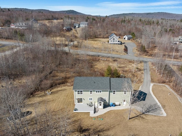 birds eye view of property with a mountain view