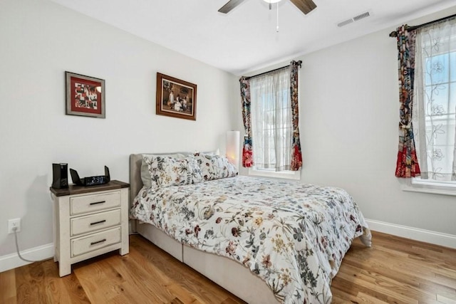 bedroom featuring light hardwood / wood-style floors and ceiling fan