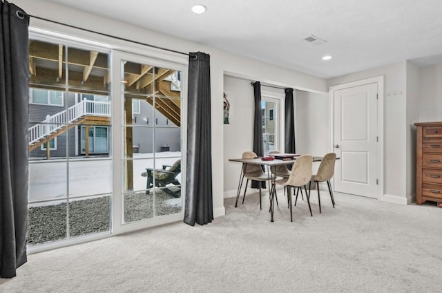 view of carpeted dining area