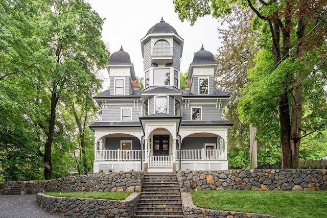 14 Summit St, Newton, MA 02458 - victorian house with covered porch and stairway