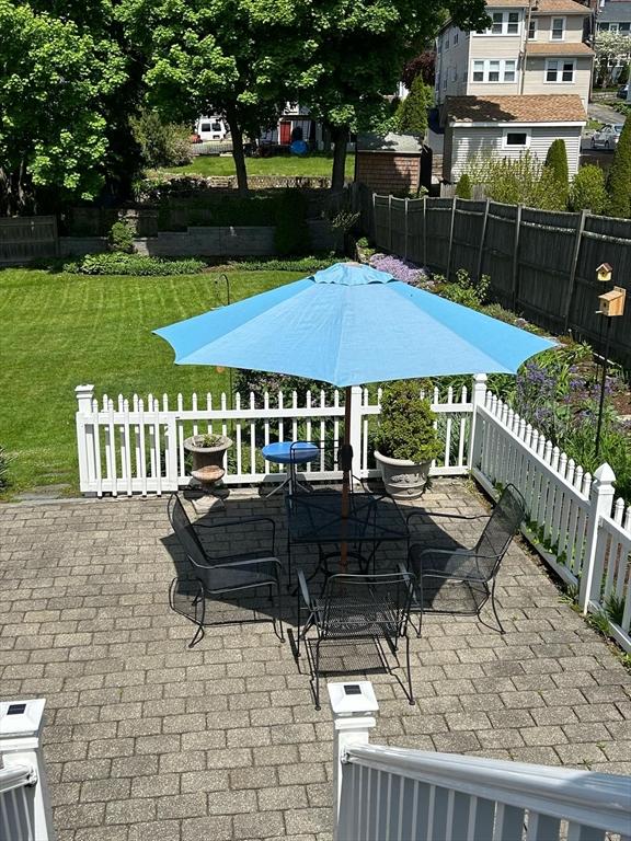 view of patio featuring outdoor dining area and fence private yard