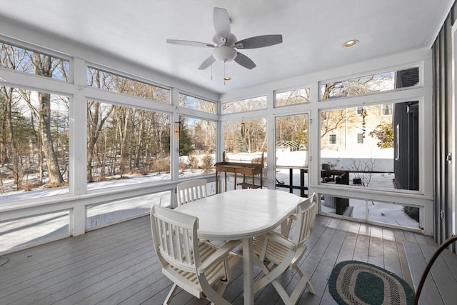 sunroom featuring plenty of natural light and ceiling fan