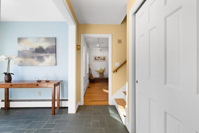 hallway with a baseboard heating unit