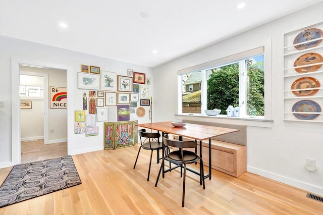dining space featuring baseboards, recessed lighting, wood finished floors, and visible vents