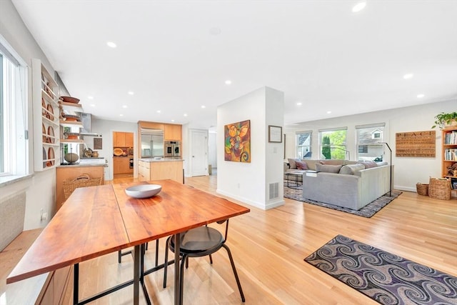 dining room featuring recessed lighting, visible vents, and light wood-type flooring