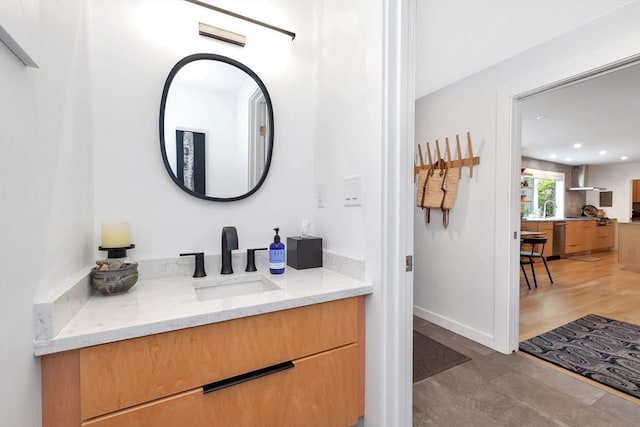 bathroom featuring vanity and recessed lighting