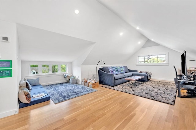 interior space with recessed lighting, baseboards, vaulted ceiling, and wood finished floors
