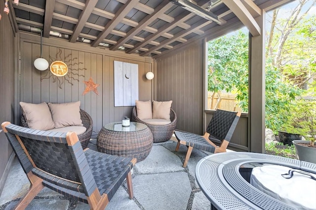 view of patio featuring fence and an outdoor living space