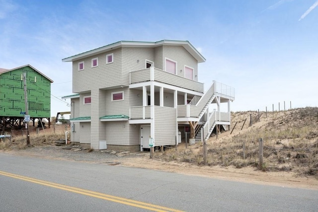 32 Northern Blvd, Newbury, MA 01951 - raised beach house with stairs and a balcony