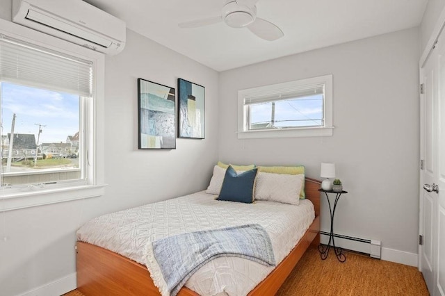 32 Northern Blvd, Newbury, MA 01951 - bedroom featuring an AC wall unit, baseboards, a ceiling fan, and baseboard heating