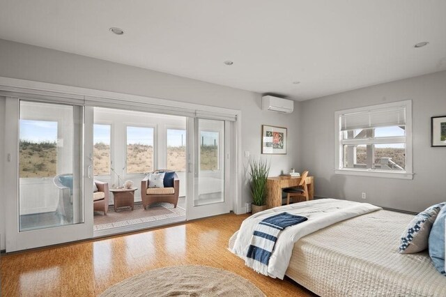 32 Northern Blvd, Newbury, MA 01951 - bedroom with access to outside, recessed lighting, a wall unit AC, and wood finished floors