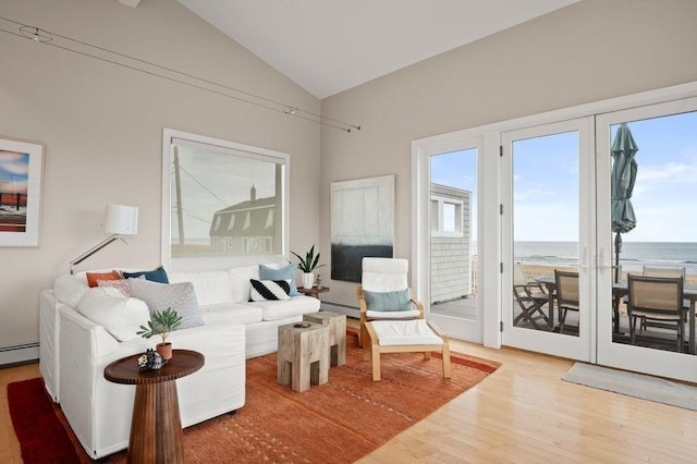 32 Northern Blvd, Newbury, MA 01951 - living room with a water view, vaulted ceiling, a baseboard heating unit, and wood finished floors