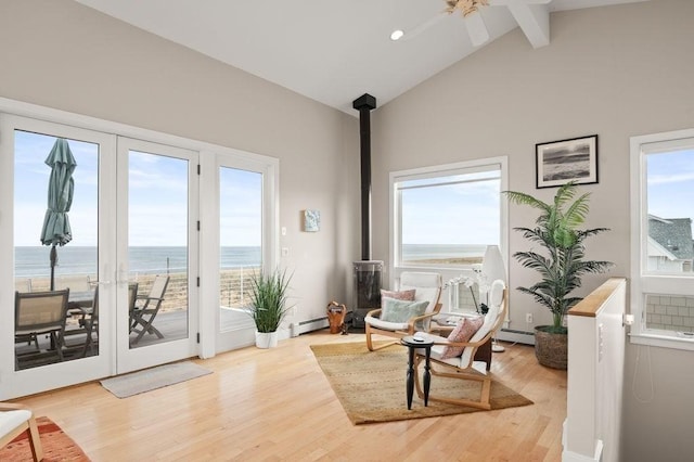 32 Northern Blvd, Newbury, MA 01951 - living area featuring a water view, beamed ceiling, a baseboard heating unit, and light wood finished floors