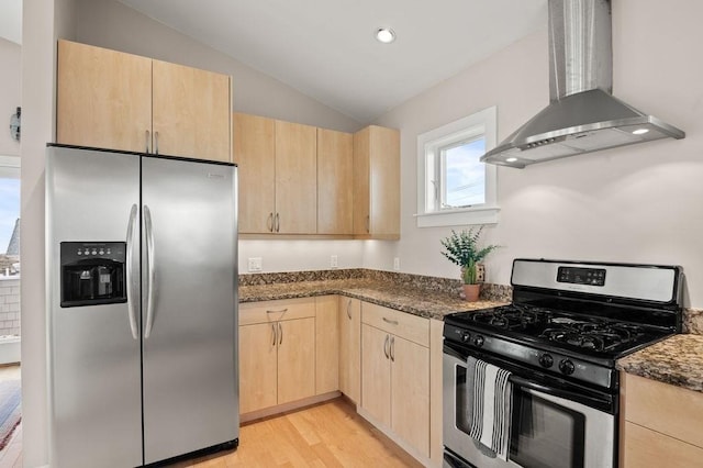 32 Northern Blvd, Newbury, MA 01951 - kitchen featuring wall chimney range hood, appliances with stainless steel finishes, light wood-type flooring, lofted ceiling, and light brown cabinets