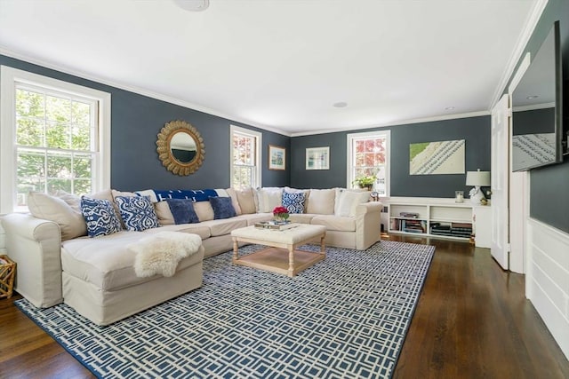 living area with dark wood-type flooring and ornamental molding