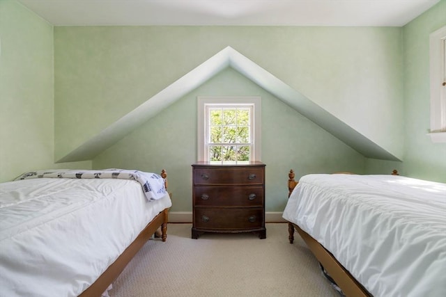 bedroom featuring carpet and baseboards