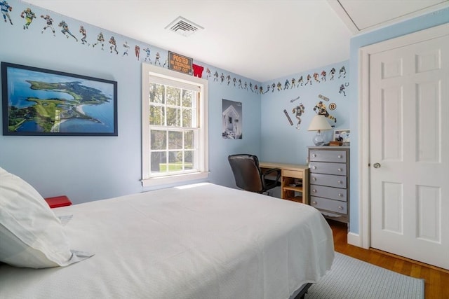 bedroom with wood finished floors