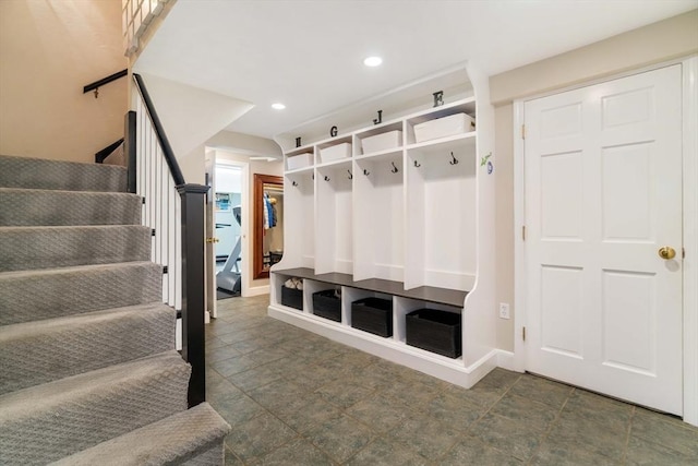 mudroom featuring recessed lighting and baseboards