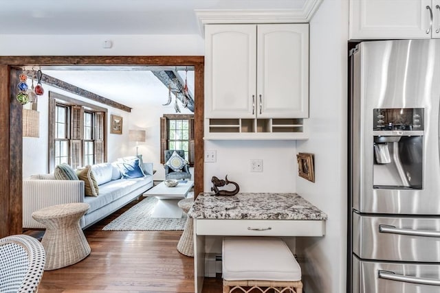 315 Pleasant St, Chatham, MA 02659 - kitchen featuring stainless steel refrigerator with ice dispenser, white cabinetry, wood finished floors, and light stone counters