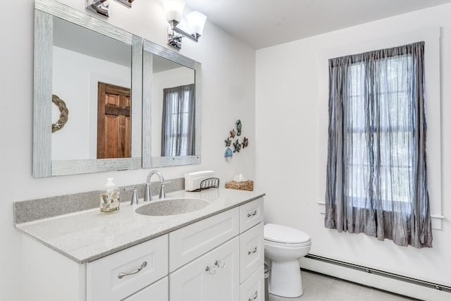 315 Pleasant St, Chatham, MA 02659 - bathroom with baseboard heating, toilet, and vanity