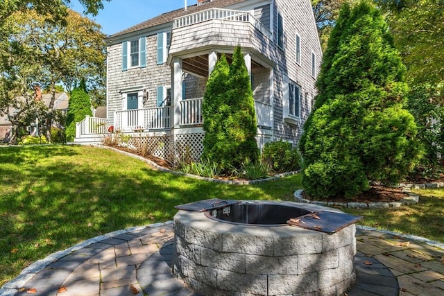 315 Pleasant St, Chatham, MA 02659 - rear view of property with a balcony and a yard