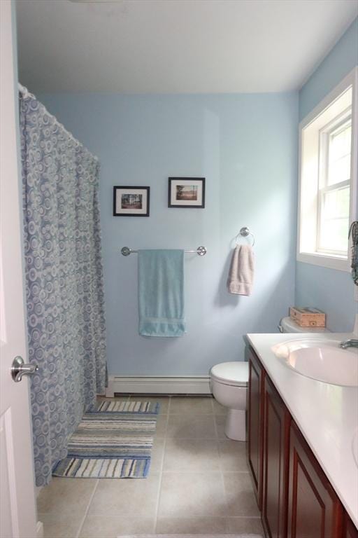 12 Sterling Ln Unit 12, Walpole, MA 02081 - full bath featuring a baseboard radiator, tile patterned flooring, toilet, and double vanity