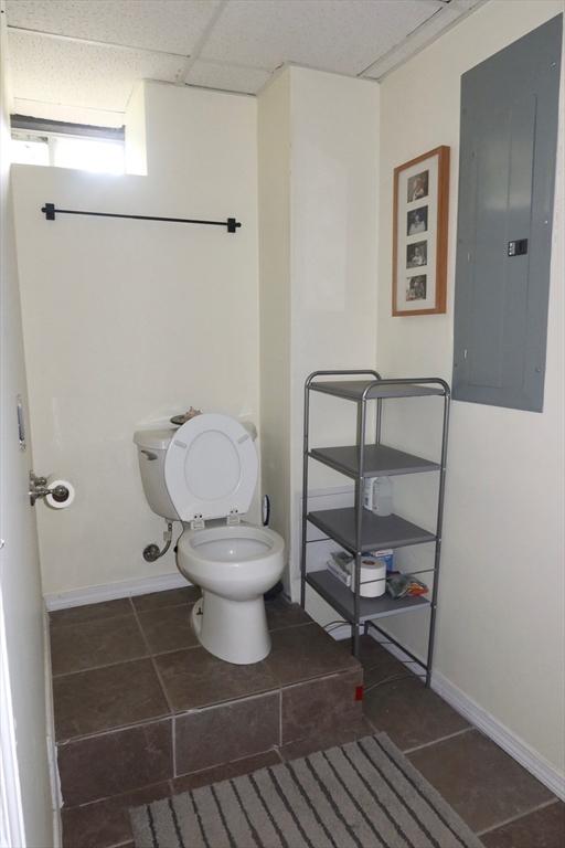 12 Sterling Ln Unit 12, Walpole, MA 02081 - bathroom featuring electric panel, toilet, tile patterned floors, and baseboards