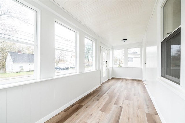 unfurnished sunroom with wood finished floors